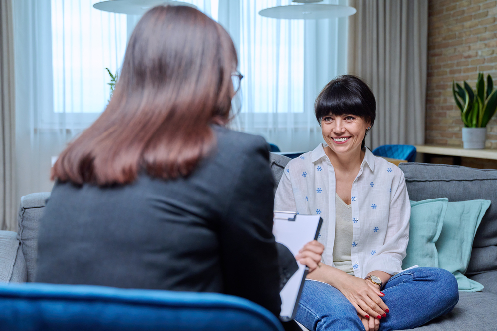 Woman at therapy meeting with psychologist.